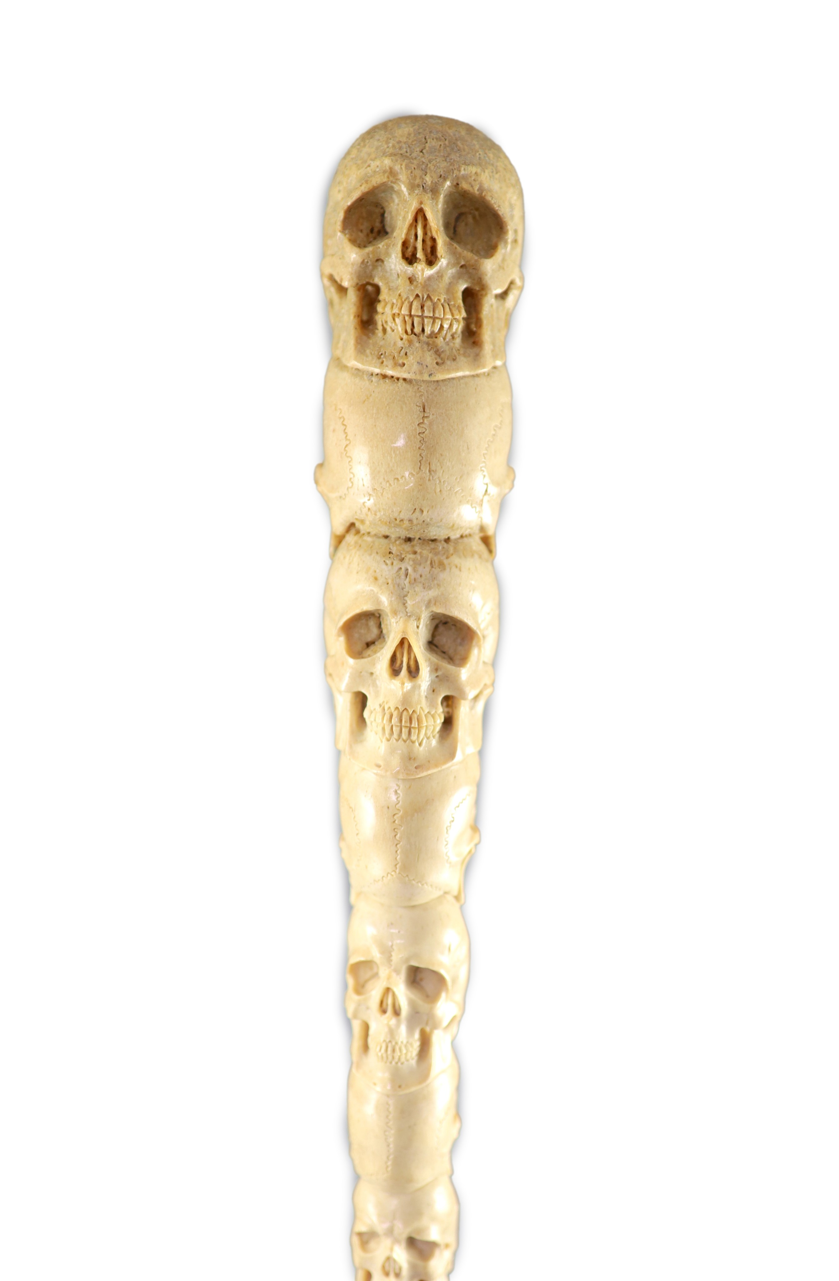 A unusual Inuit ‘skull’ carved walrus baculum, believed to be 19th century, 49.5 cm long
